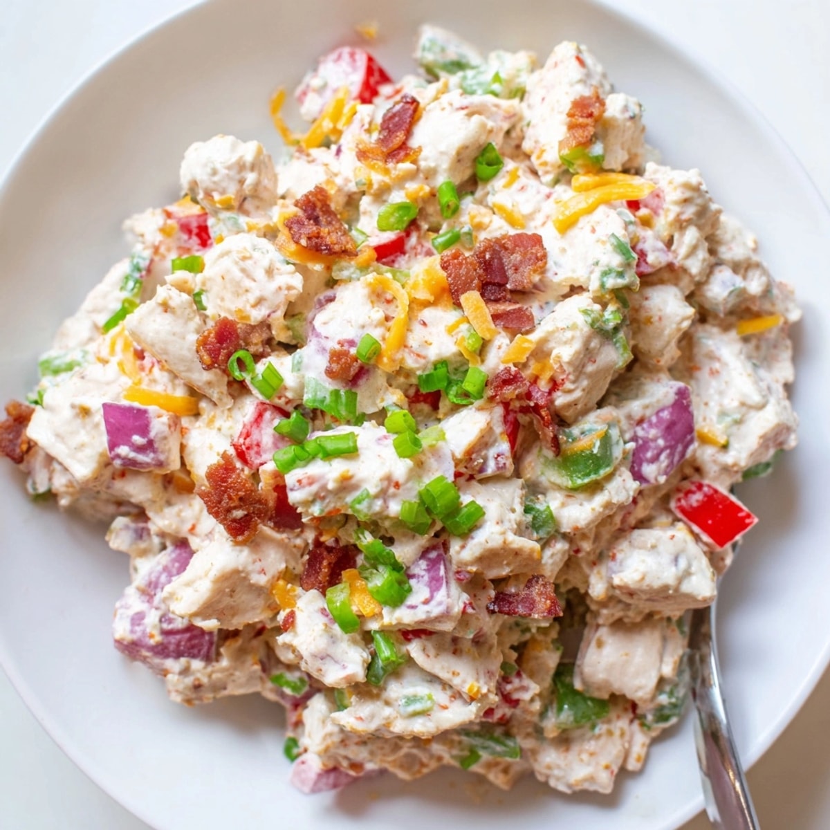 Homemade Jalape&amp;ntilde;o Popper Chicken Salad recipe, featuring juicy chicken, peppers, and creamy dressing.