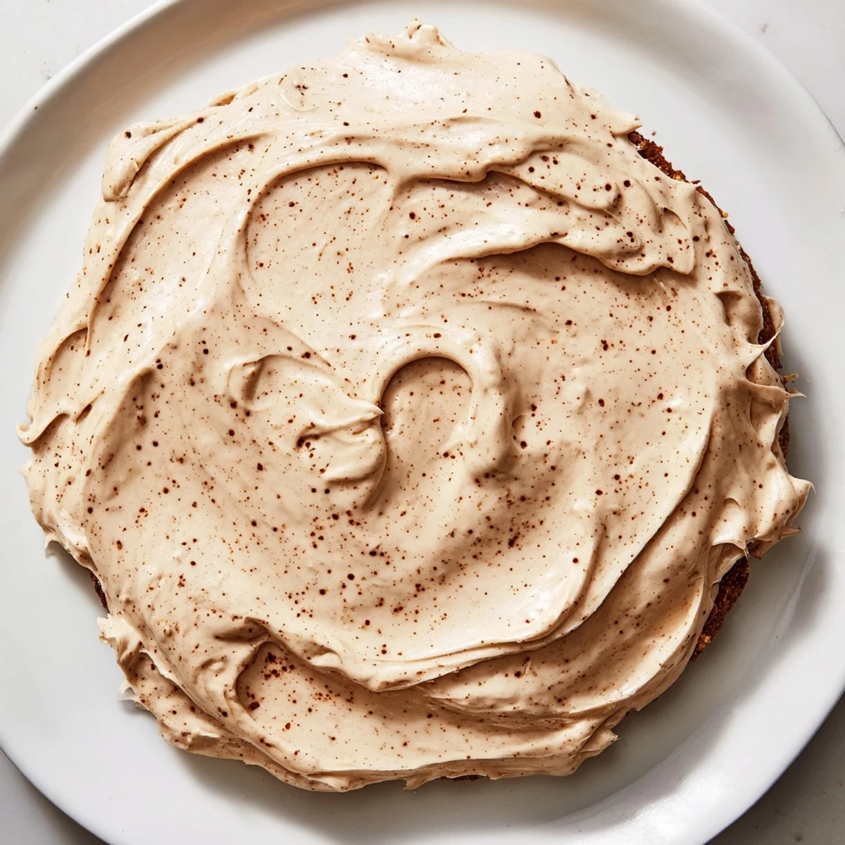Homemade Gingerbread Frosting, offering warm, inviting flavors, ideal for gingerbread cookies.