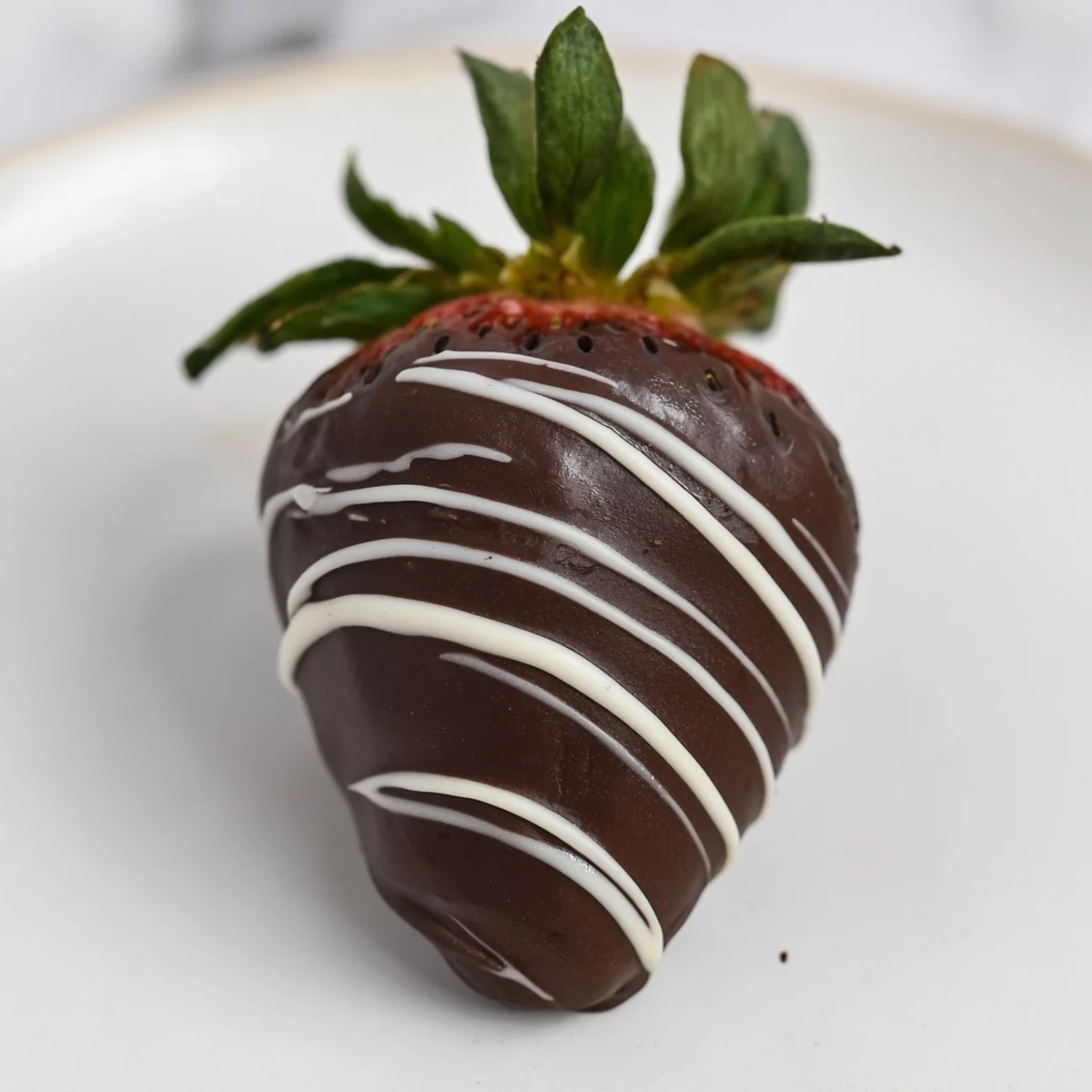 Fresh, glossy chocolate strawberries, a decadent dessert, perfect for any special occasion.