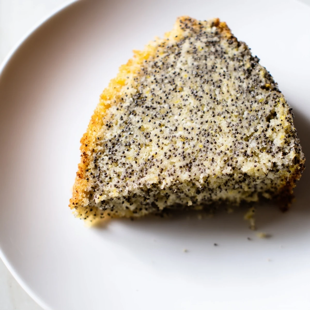 Fluffy slices of poppy seed cake, fragrant with lemon and ideal for a dessert spread.