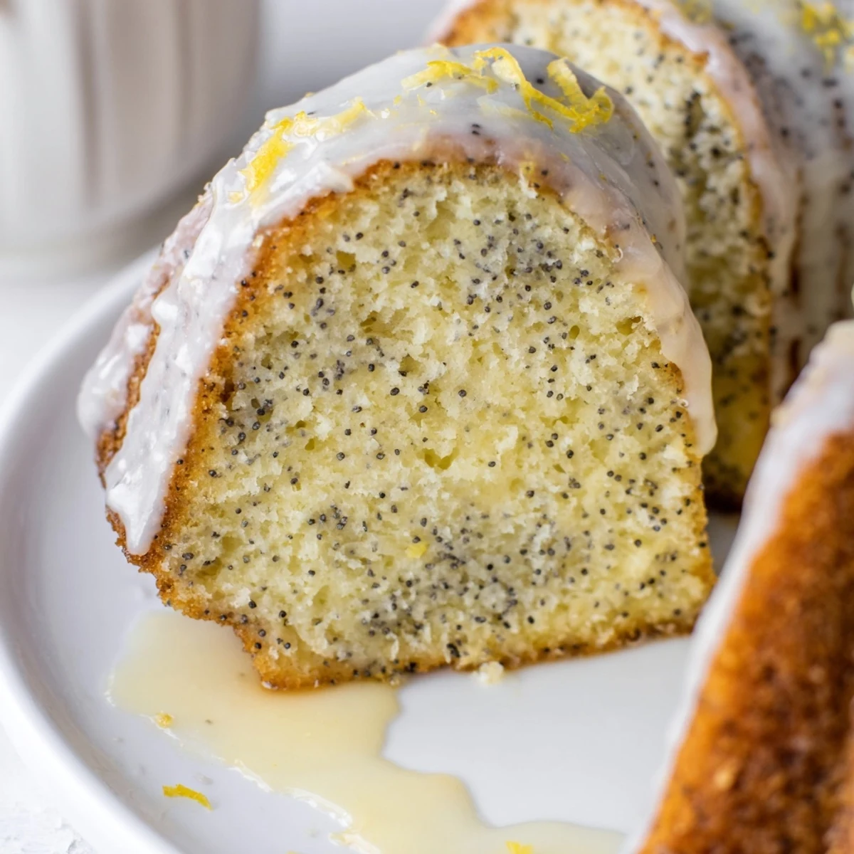Freshly baked, aromatic Lemon Poppy Seed Bundt Cake, perfect for afternoon tea with a bright lemon flavor.