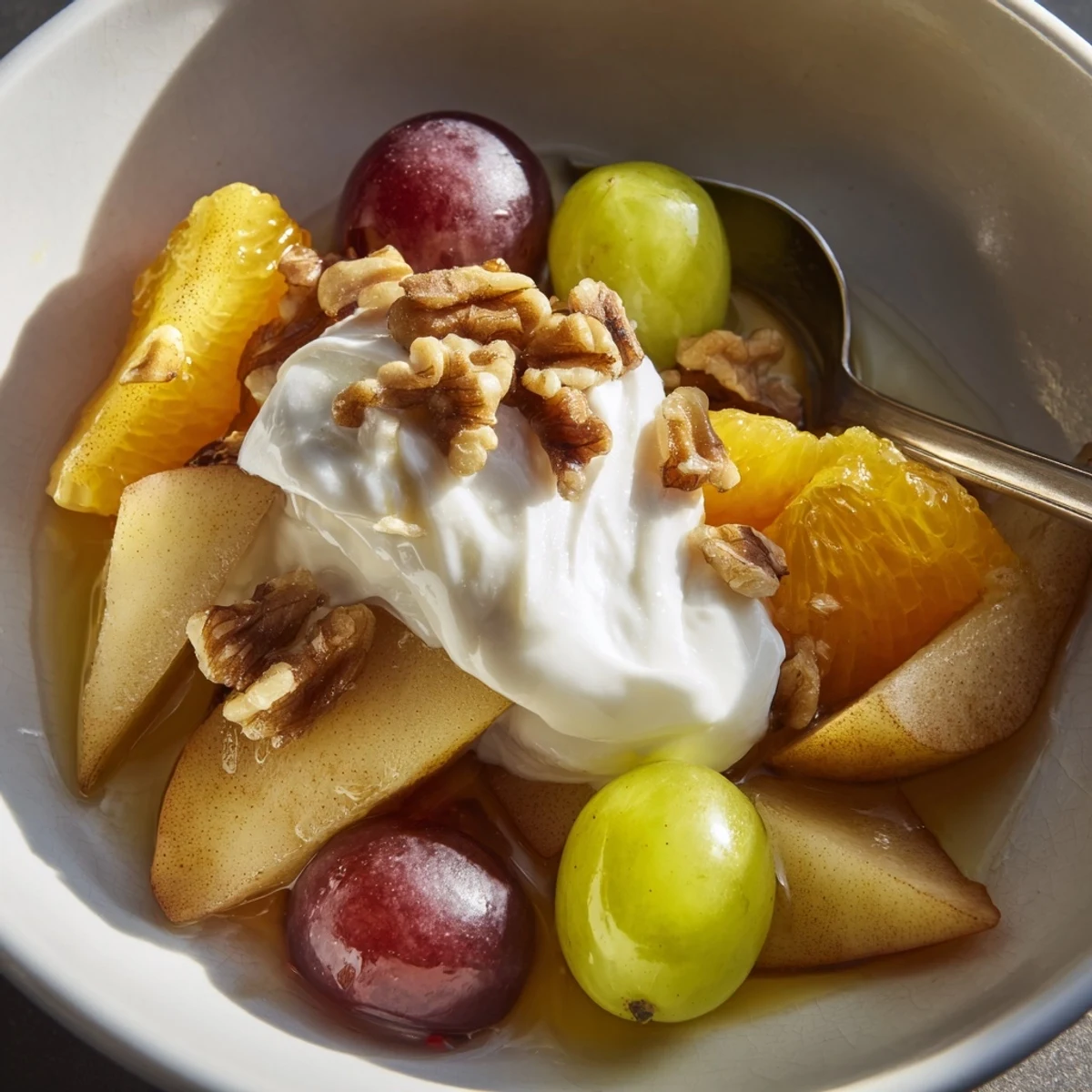 Served chilled, this Spiced Fruit with Cinnamon highlights colorful grapes and orange segments.