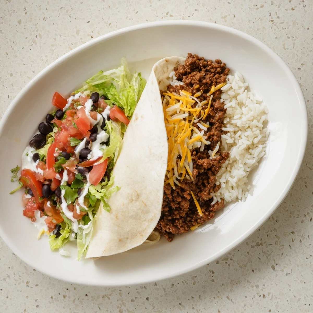 A cut-open Beef Burrito with Rice and Beans reveals layers of seasoned ground beef, rice, beans, and melted cheddar cheese.