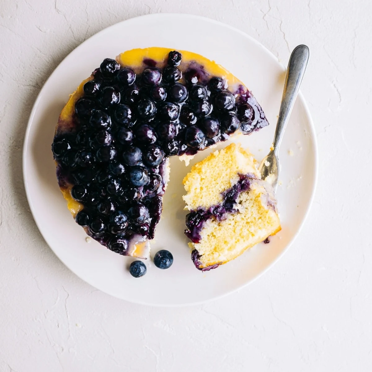 Fresh blueberry upside down cake baked to golden perfection with bubbling fruit topping
