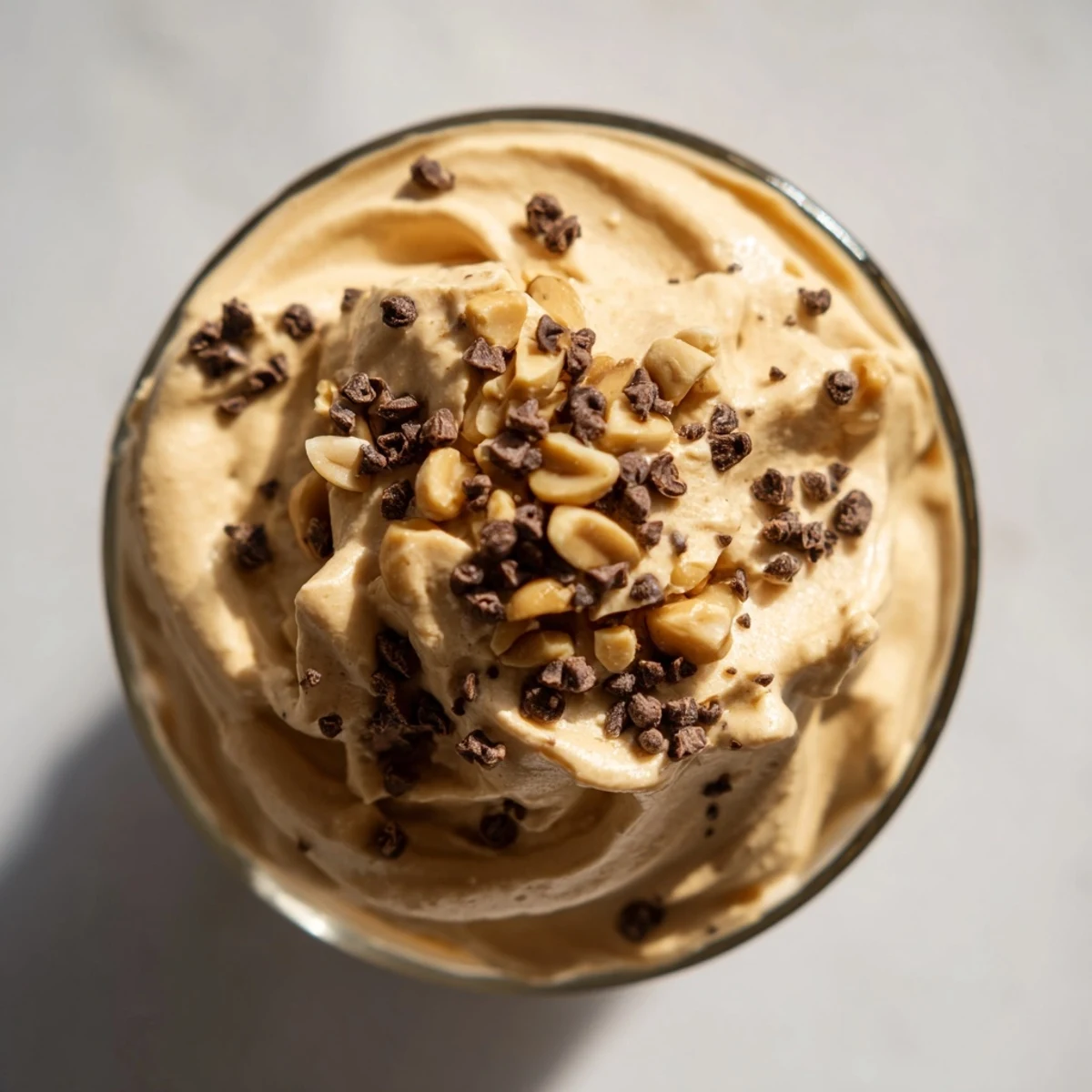 Creamy peanut butter and Cool Whip mousse spooned into glass dessert cups