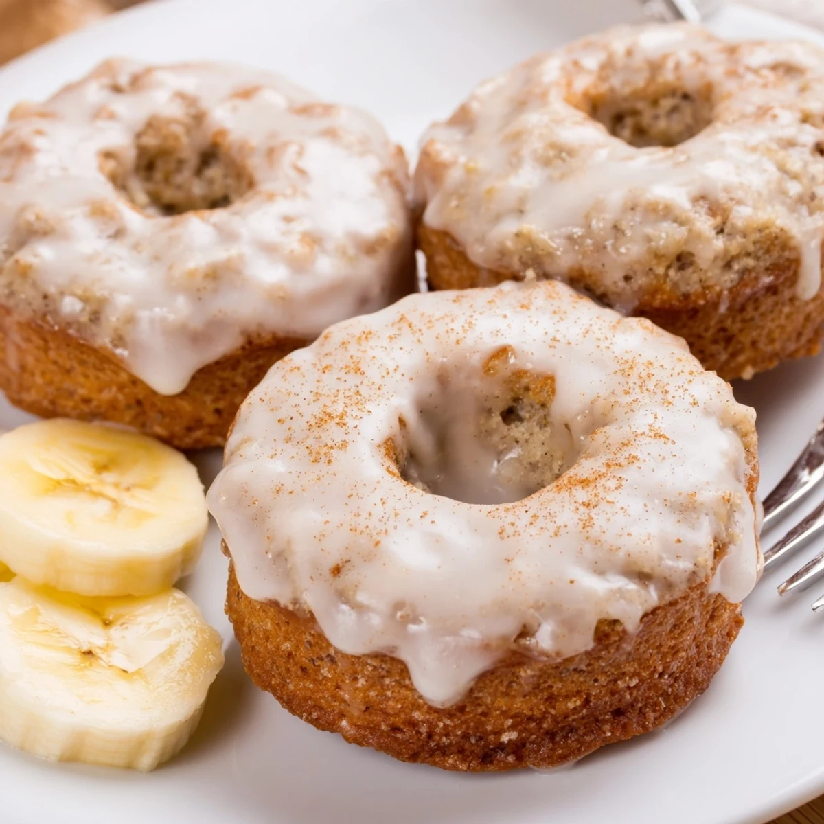 Warm Banana Donuts with golden crust and tender, banana-scented cake.