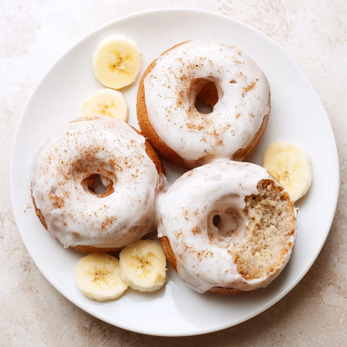 Fresh Banana Donuts cooling on wire rack, ready to glaze and eat.