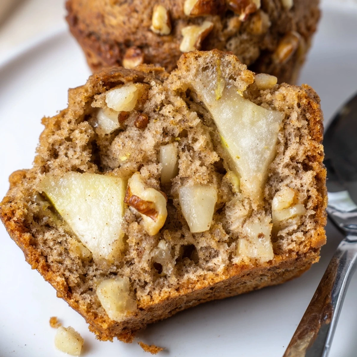 Warm Healthy Apple Cinnamon Greek Yogurt Muffins split open, tender crumbs