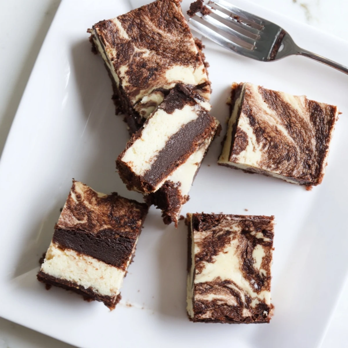 Homemade sourdough cheesecake brownie bars with tangy cream cheese topping and moist chocolate interior