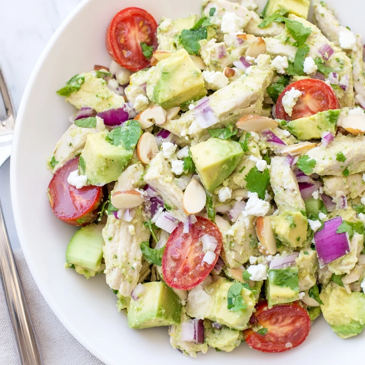 Chilled Avocado Chicken Salad tossed with cucumber, red onion, zesty lime