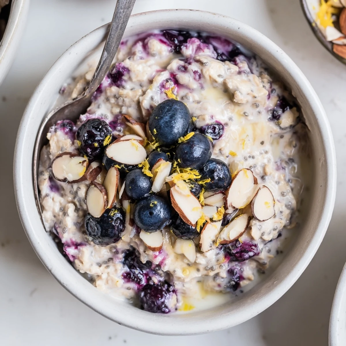 Blueberry Lemon Overnight Oats topped with fresh blueberries and crunchy almonds