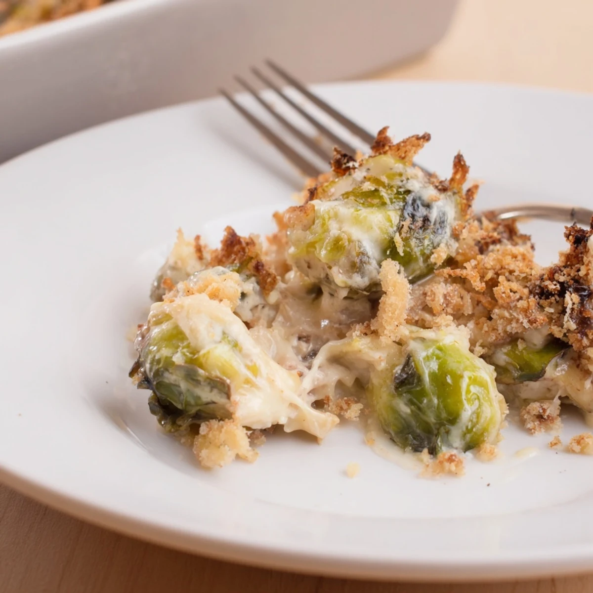 Creamy Parmesan Brussels Sprouts Casserole bubbling golden, cheesy topping, ready to serve