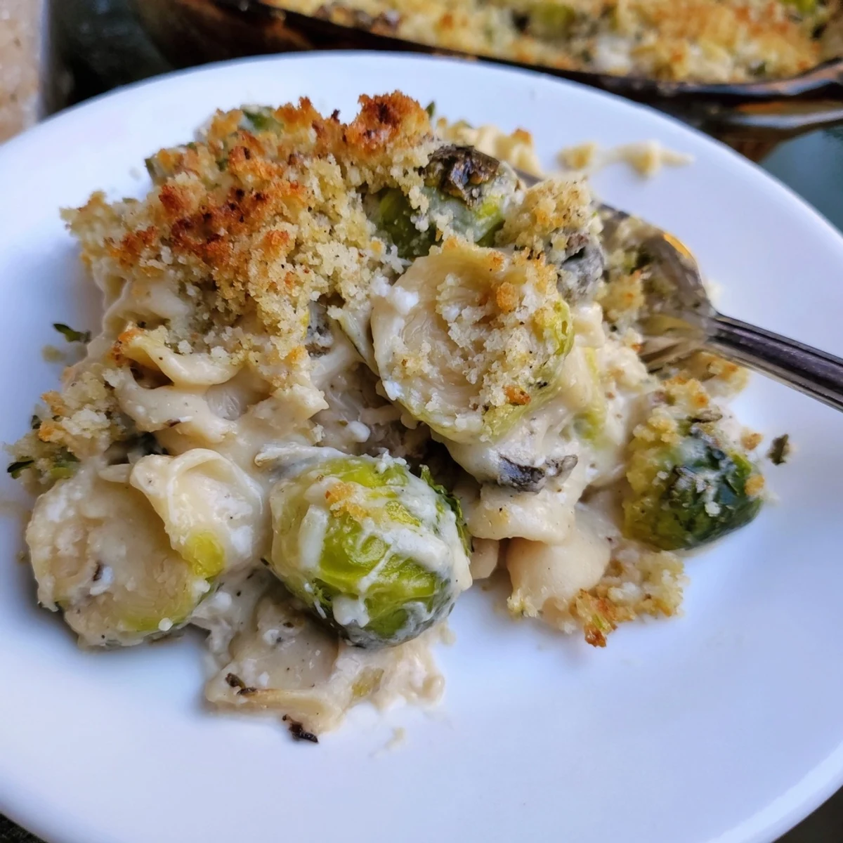 Holiday ready Creamy Parmesan Brussels Sprouts Casserole with tender centers and crisp breadcrumb crust
