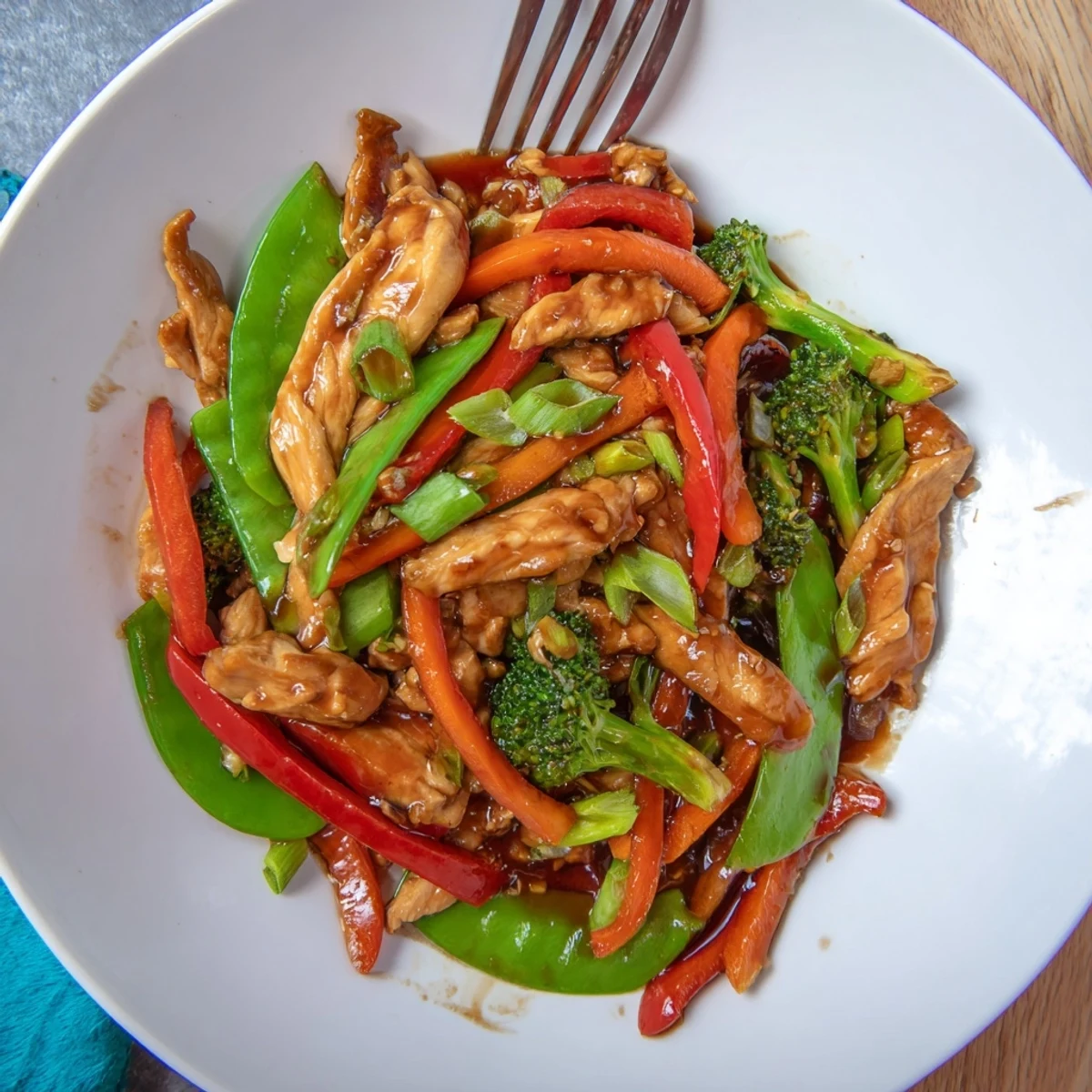 Hunan Chicken glistening with spicy chili sauce over a bed of steamed white rice