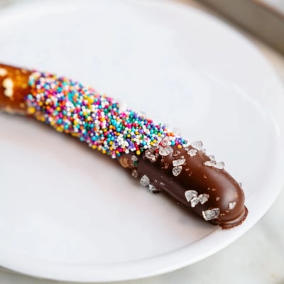 Chilled, firm chocolate on the rods contrasts with salty crunch and bright sprinkles for an easy party snack.